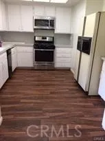 a kitchen with a sink and a microwave