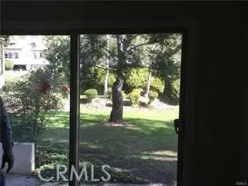 a view of a yard from a balcony