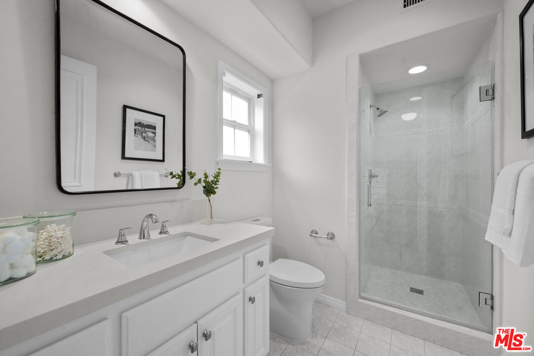 7861 West 80th Street Playa del Rey, CA 90293 - Photo 18 of 42 a bathroom with a sink a toilet and shower