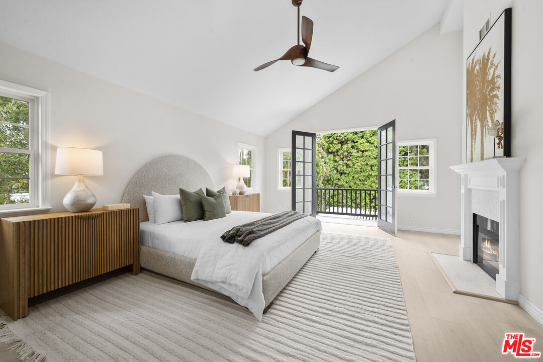 7861 West 80th Street Playa del Rey, CA 90293 - Photo 23 of 42 a bedroom with a large bed and a chandelier