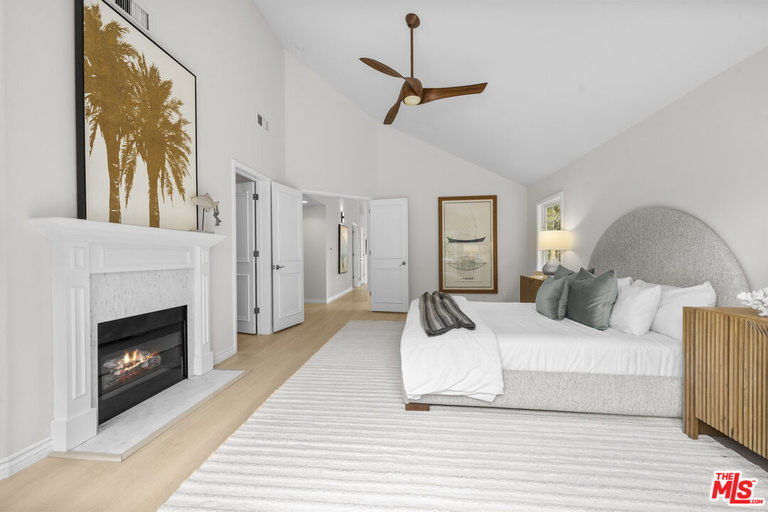 7861 West 80th Street Playa del Rey, CA 90293 - Photo 24 of 42 a living room with a bed furniture and a fireplace