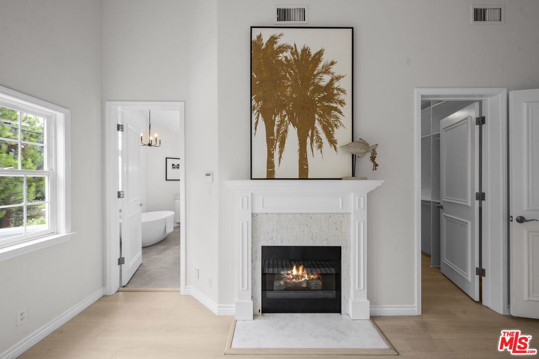 7861 West 80th Street Playa del Rey, CA 90293 - Photo 25 of 42 a living room with furniture a fireplace and a window