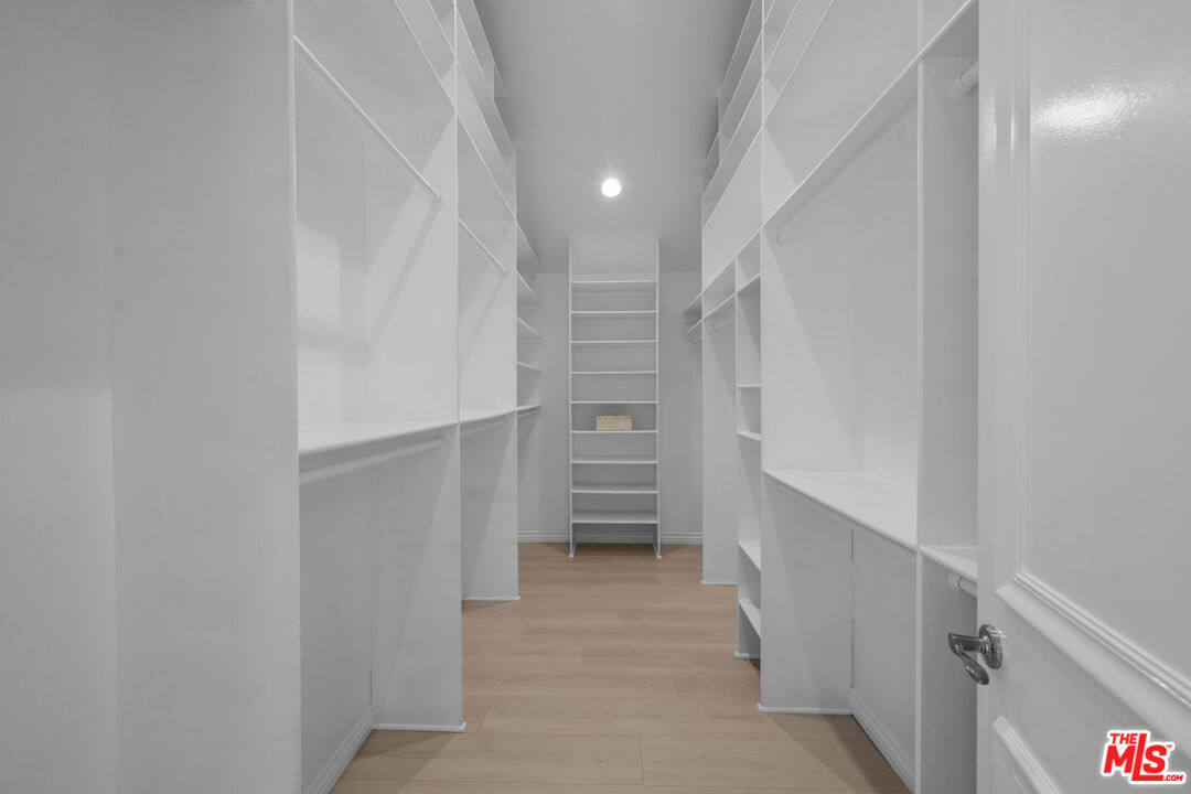7861 West 80th Street Playa del Rey, CA 90293 - Photo 31 of 42 a view of walk in closet with empty racks