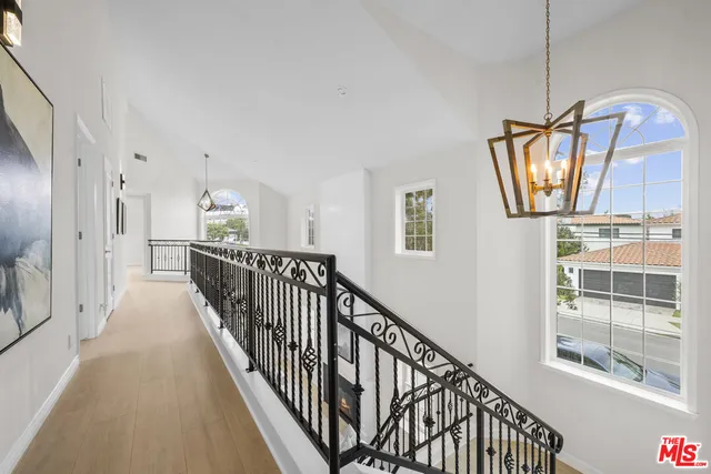 a view of a hallway with windows