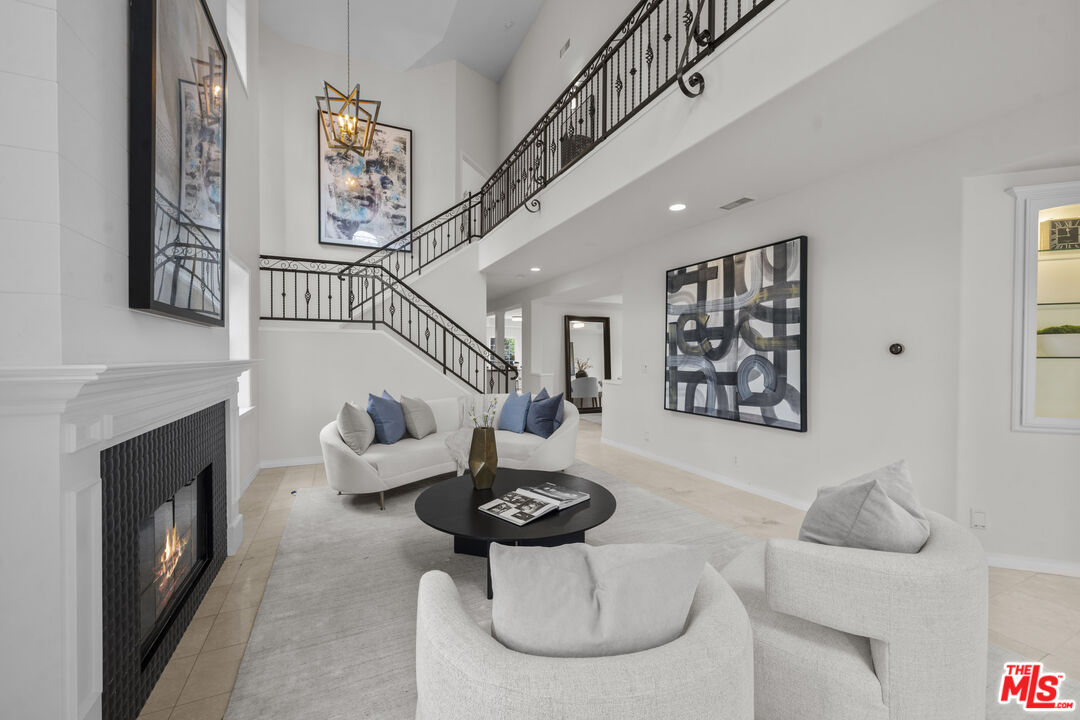 7861 West 80th Street Playa del Rey, CA 90293 - Photo 6 of 42 a living room with furniture potted plants and a fireplace