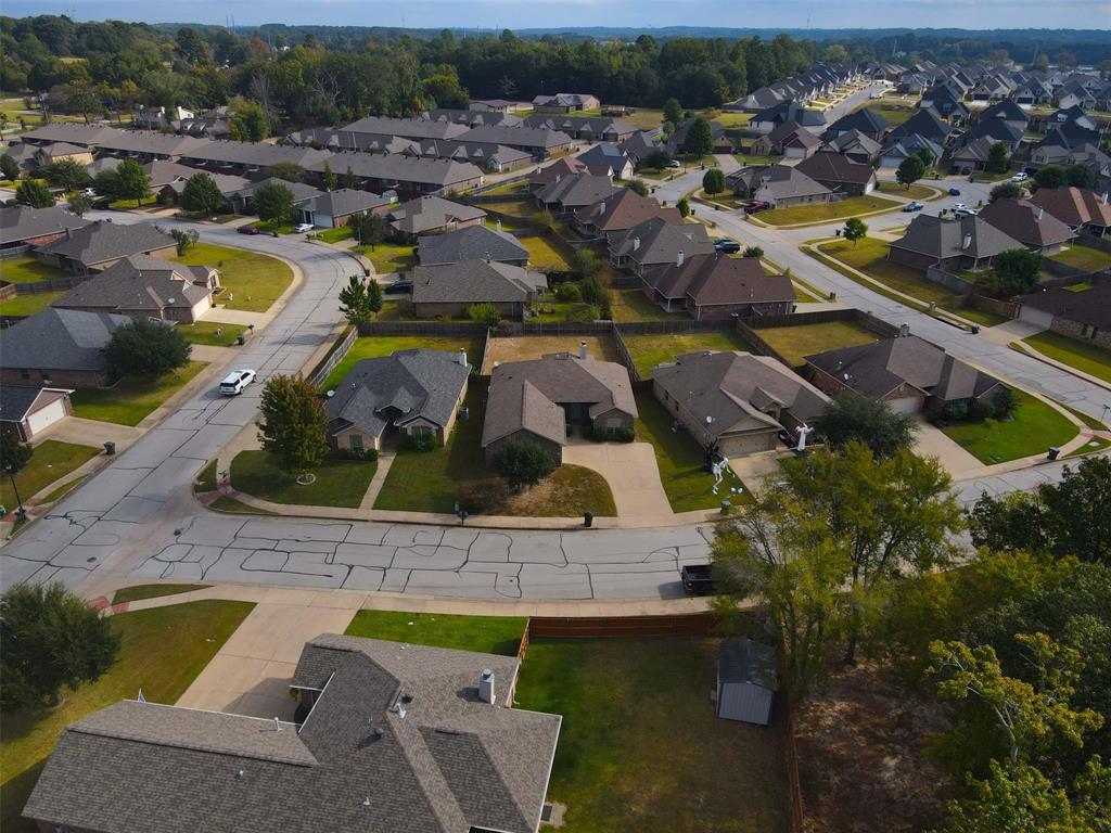 2512 Guinn Farms Road Tyler, TX 75707 - Photo 7 of 29 an aerial view of residential houses with outdoor space