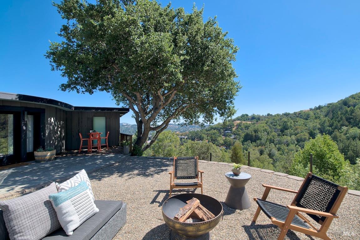 600 Murray Avenue Kentfield, CA 94904 - Photo 12 of 59 a view of a patio with table and chairs with wooden floor and fence