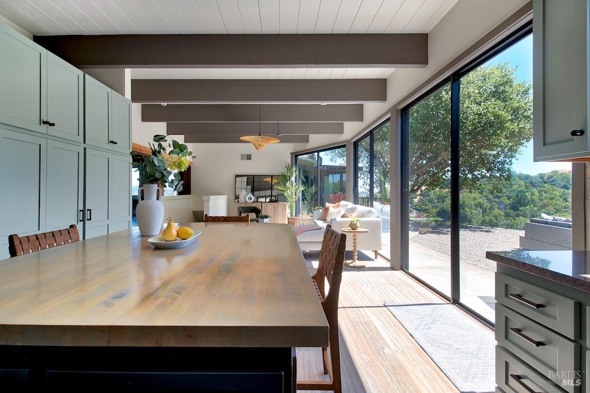 600 Murray Avenue Kentfield, CA 94904 - Photo 20 of 59 a dining room with furniture and a floor to ceiling window