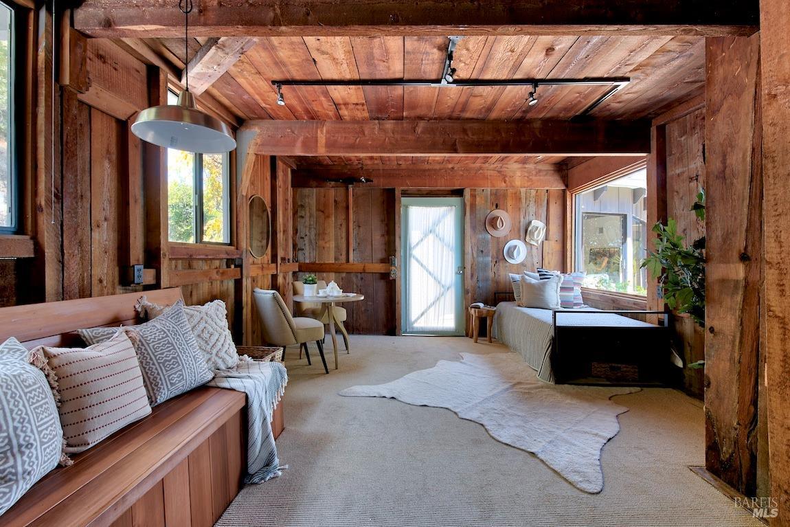 600 Murray Avenue Kentfield, CA 94904 - Photo 33 of 59 a living room with furniture a large window and potted plants