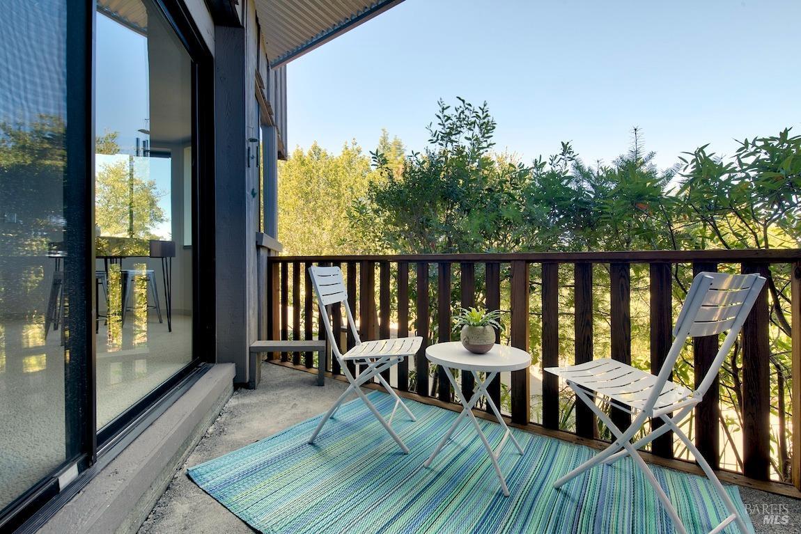 600 Murray Avenue Kentfield, CA 94904 - Photo 40 of 59 a balcony with wooden floor table and chairs