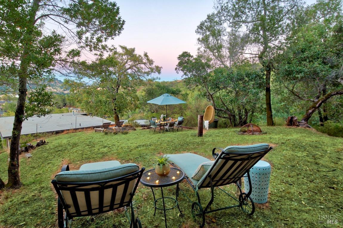 600 Murray Avenue Kentfield, CA 94904 - Photo 49 of 59 a view of a table and chairs in the garden