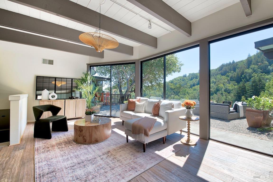 600 Murray Avenue Kentfield, CA 94904 - Photo 5 of 59 a living room with furniture a fireplace and a large window
