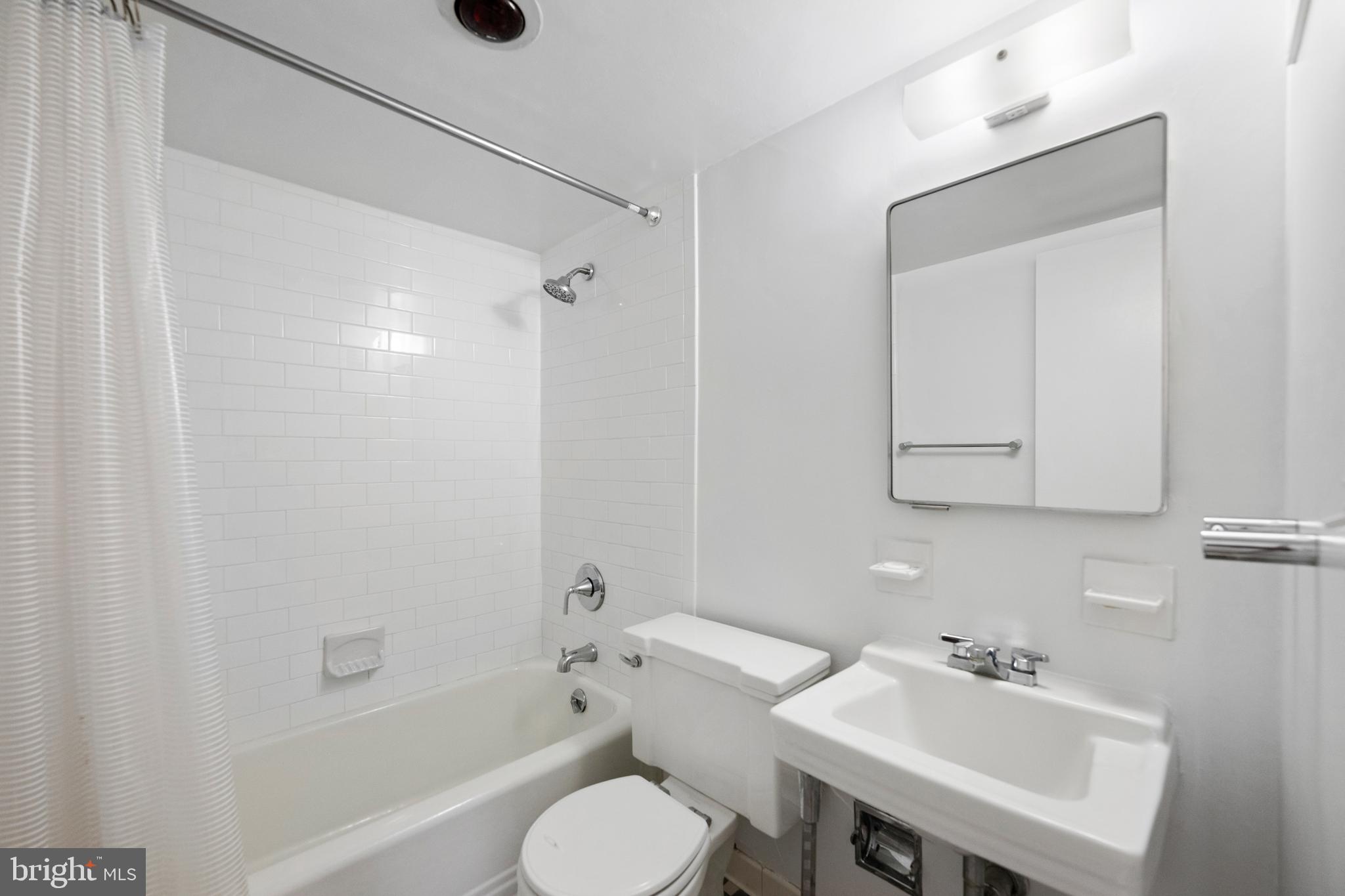 200 Locust Street, Unit 10GN Philadelphia, PA 19106 - Photo 17 of 28 a bathroom with a sink toilet and shower