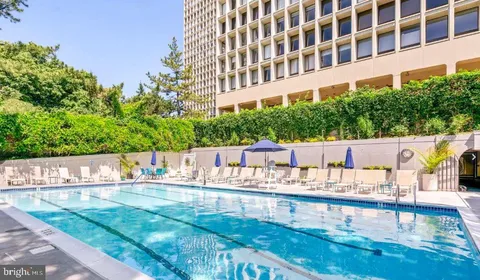 a balcony with furniture and garden view