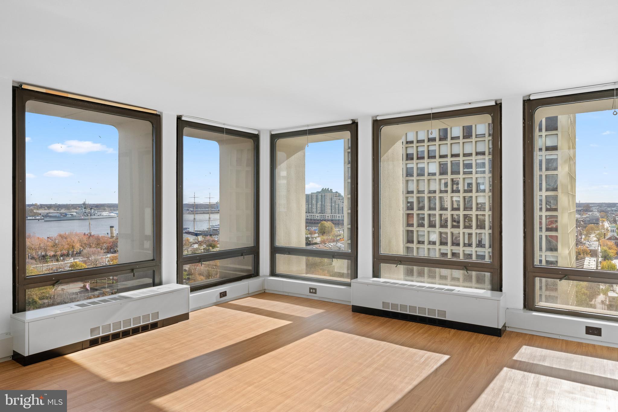 200 Locust Street, Unit 10GN Philadelphia, PA 19106 - Photo 10 of 28 a spacious bedroom with a large window and a balcony