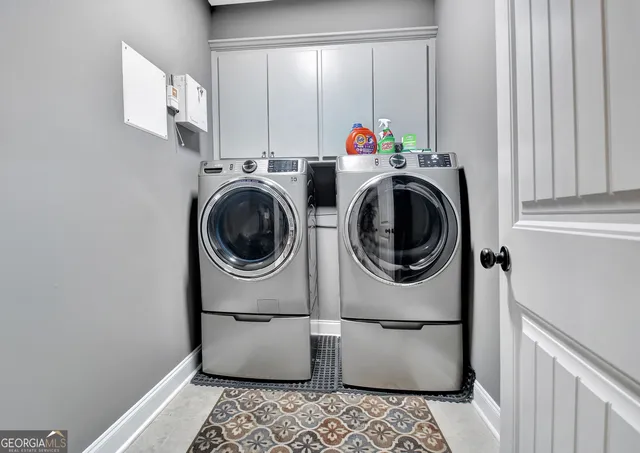 a utility room with dryer and washer