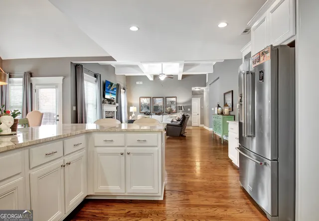 a kitchen with counter top space and refrigerator