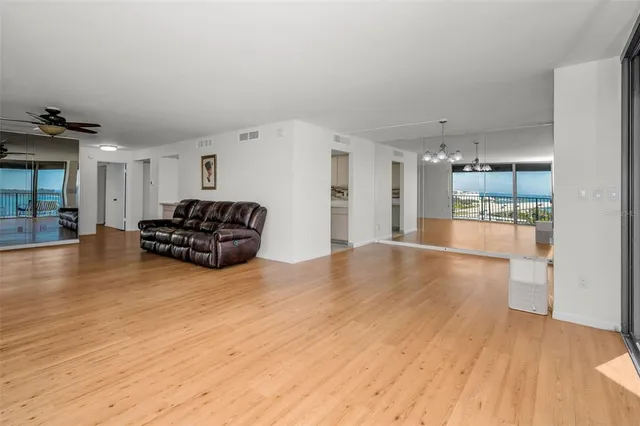 a kitchen with stainless steel appliances a sink stove and cabinets