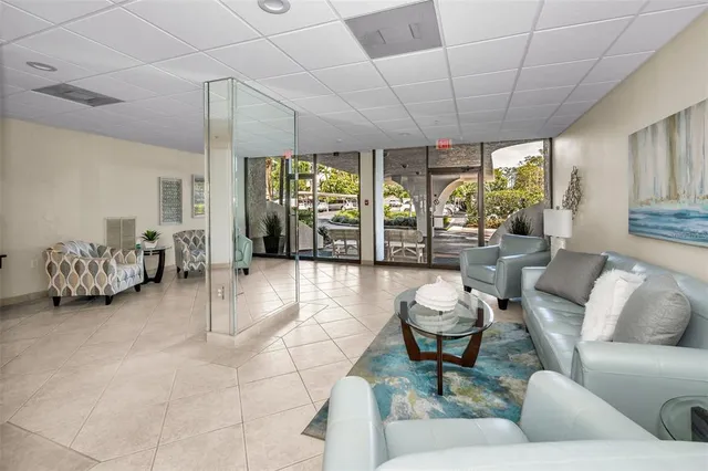 a lobby with furniture and a large window