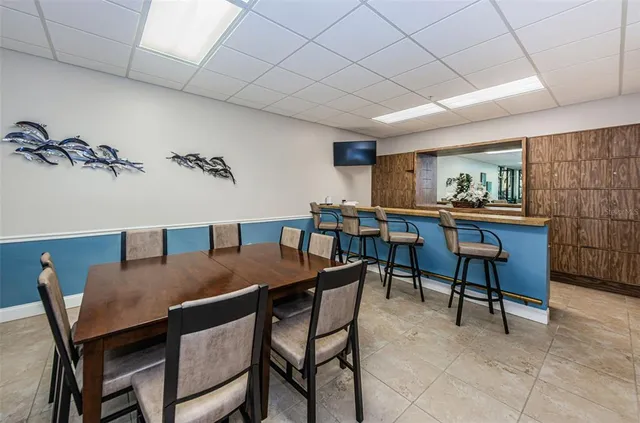 a bedroom with furniture and a large window