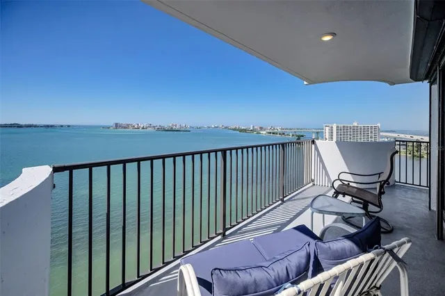 a view of balcony with wooden floor and outdoor seating