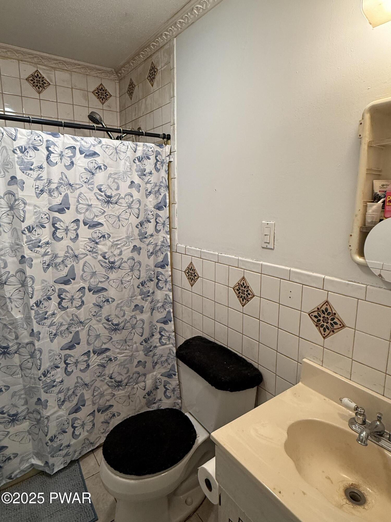 103 Stonehenge Road Milford, PA 18337 - Photo 13 of 20 a bathroom with a sink and a toilet