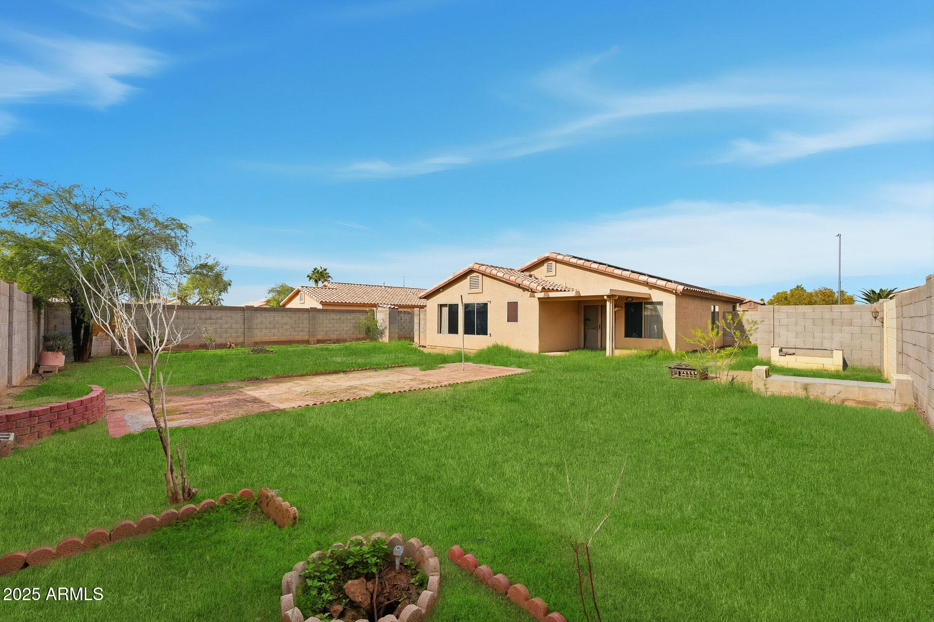 16065 West Jackson Street Goodyear, AZ 85338 - Photo 16 of 18 a front view of house with yard and green space