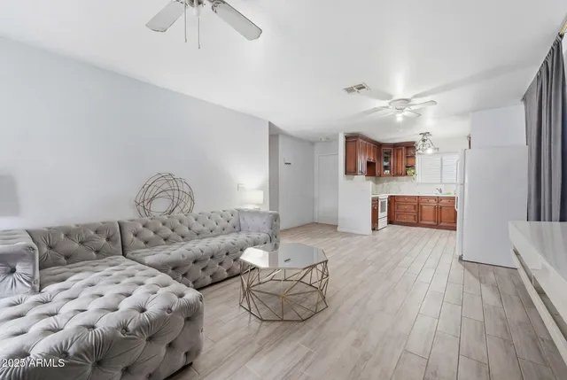 a large room with lots of appliances and furniture