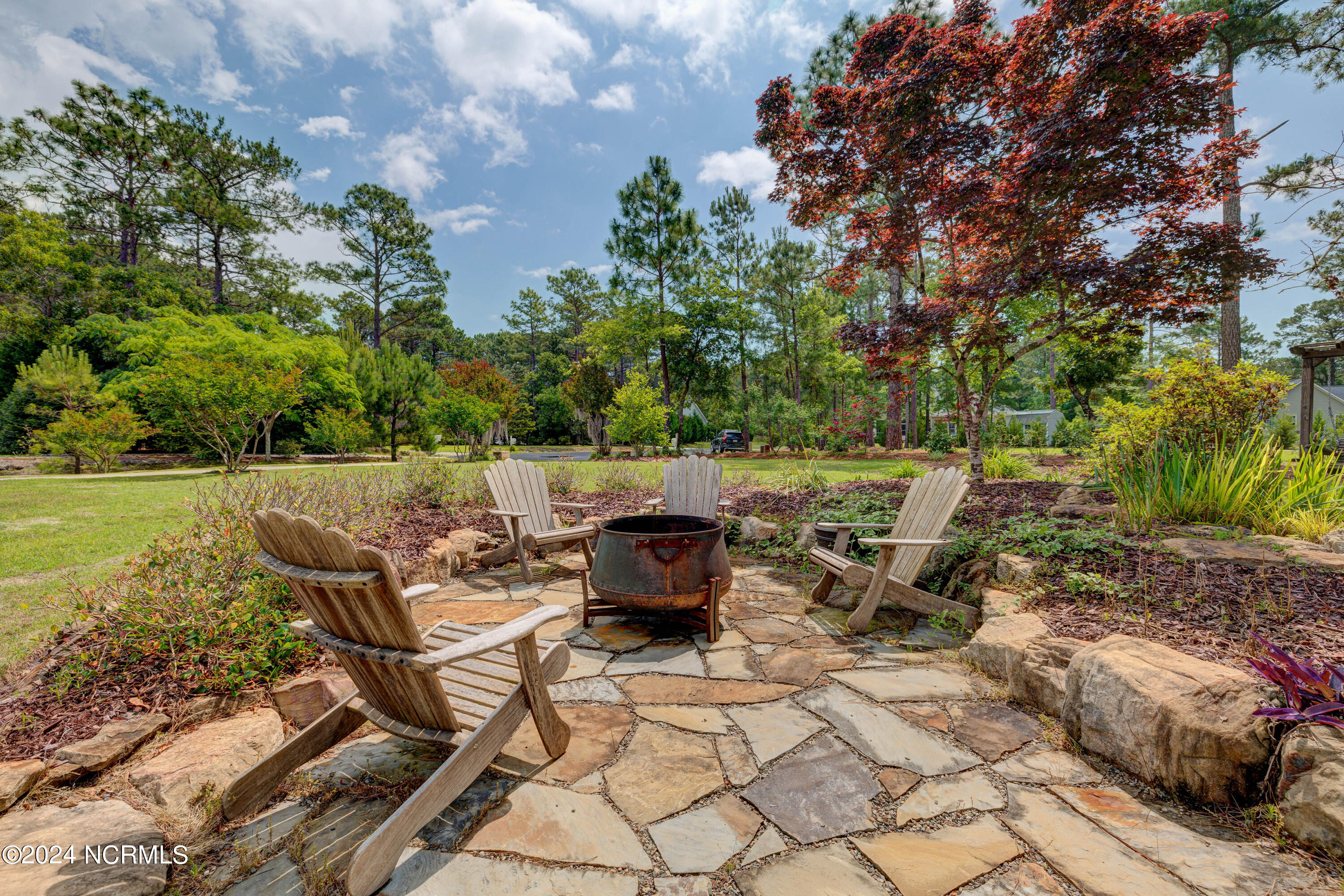 105 Duck Court Hampstead, NC 28443 - Photo 57 of 60 Stone Garden with Fire Pit