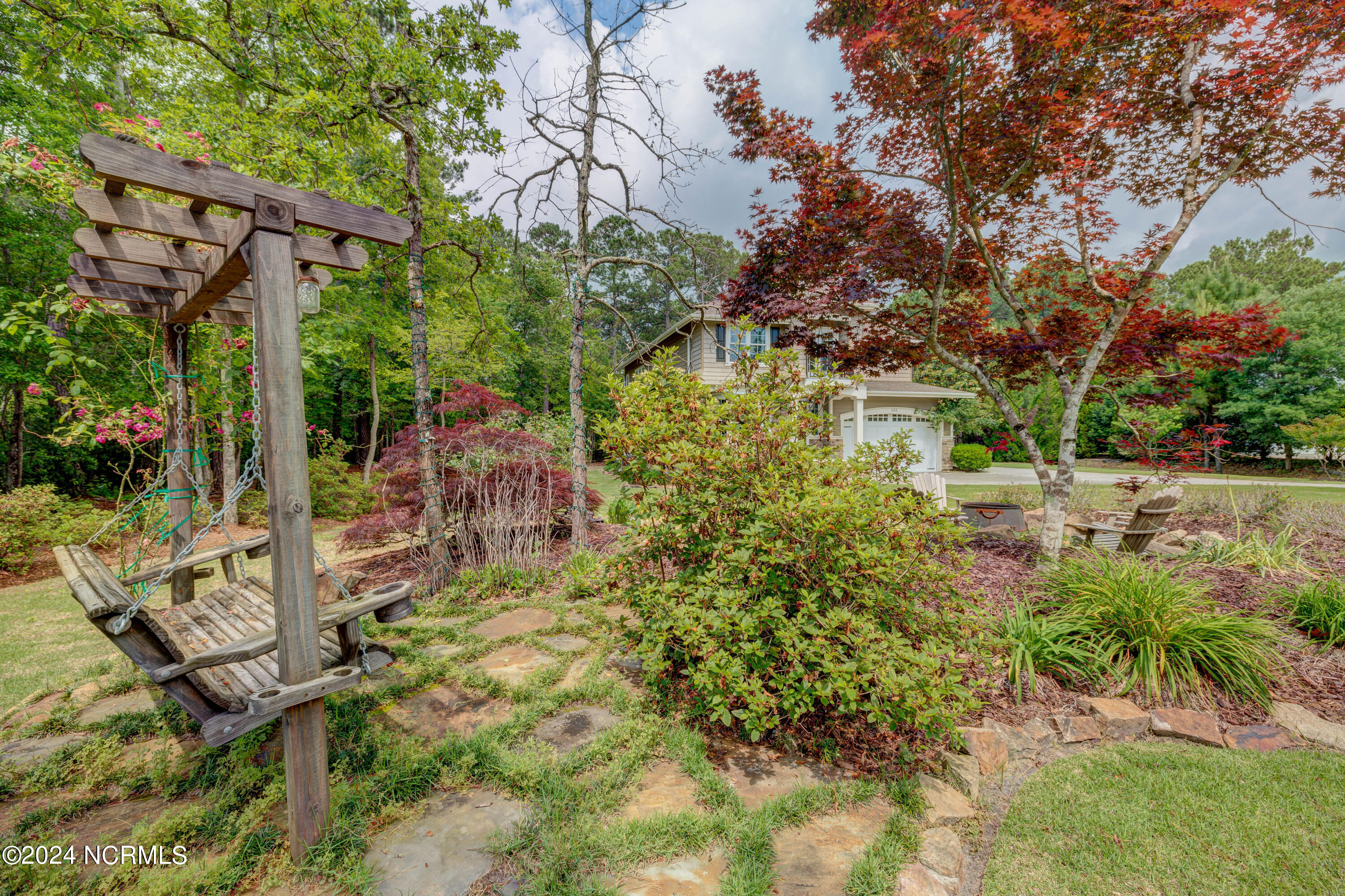 105 Duck Court Hampstead, NC 28443 - Photo 59 of 60 Swing with stone garden