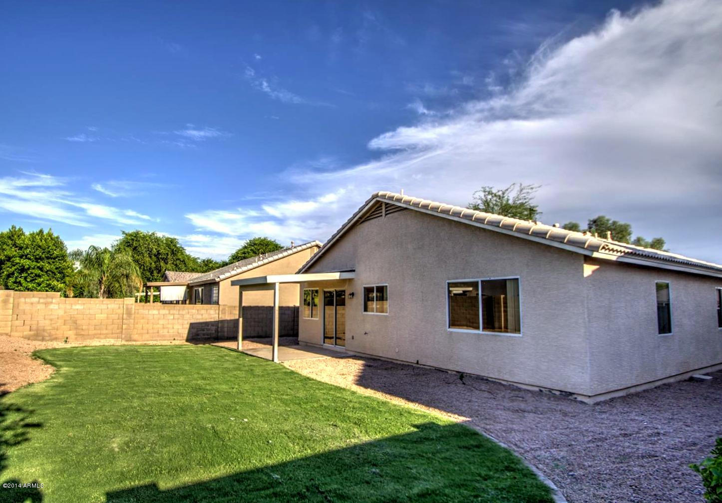 2822 East Harwell Road Gilbert, AZ 85234 - Photo 20 of 23 Grassy Backyard w/sprinklers on timer