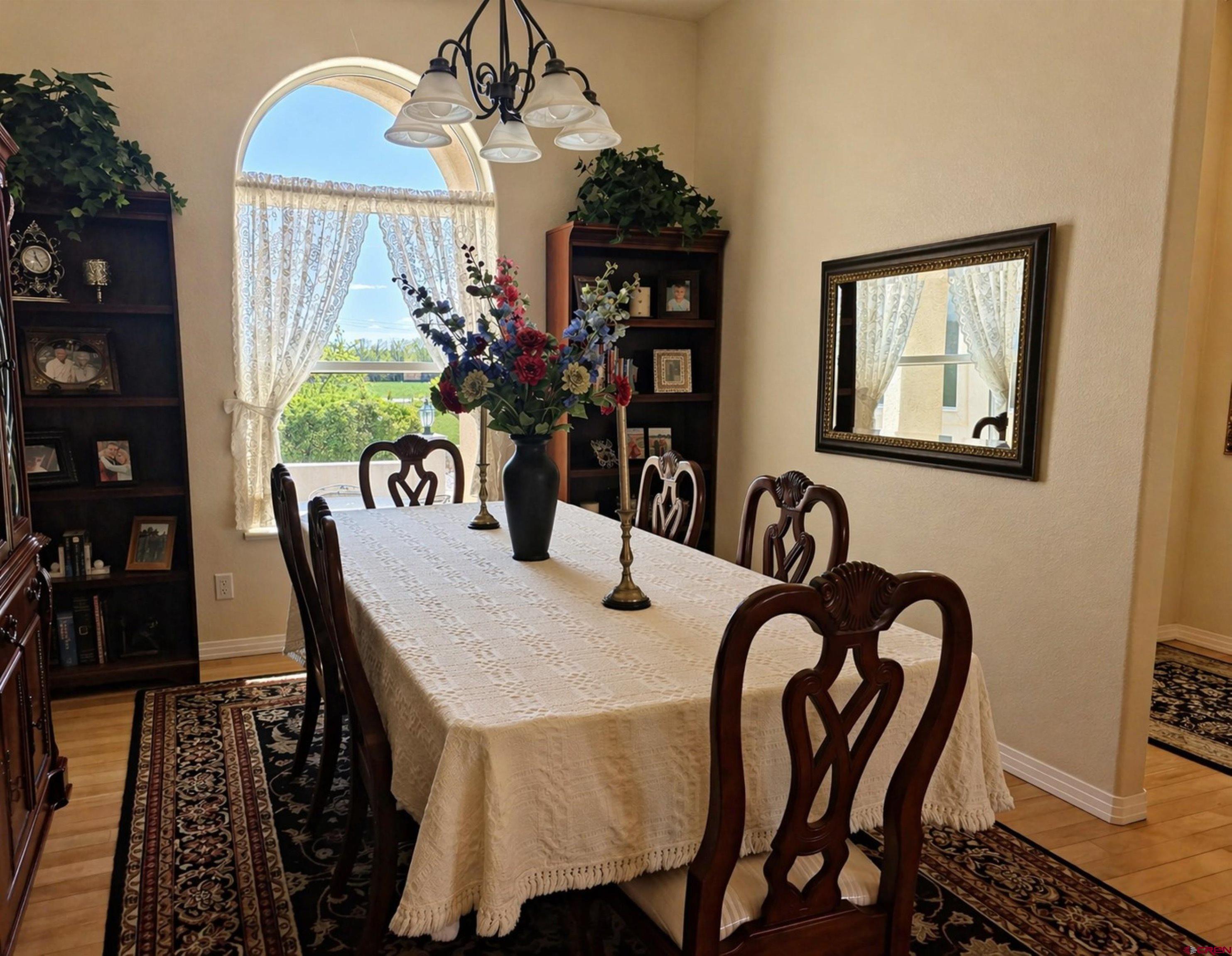 2357 5500th Road Delta, CO 81416 - Photo 11 of 37 a view of a dining room with furniture and chandelier