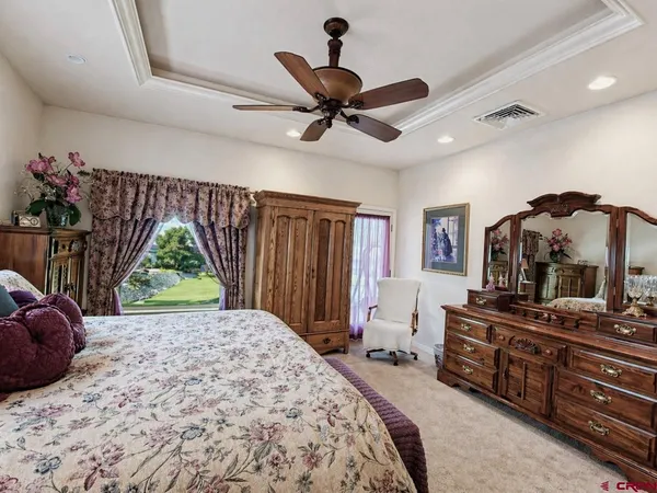 a bed room with a bed and a television