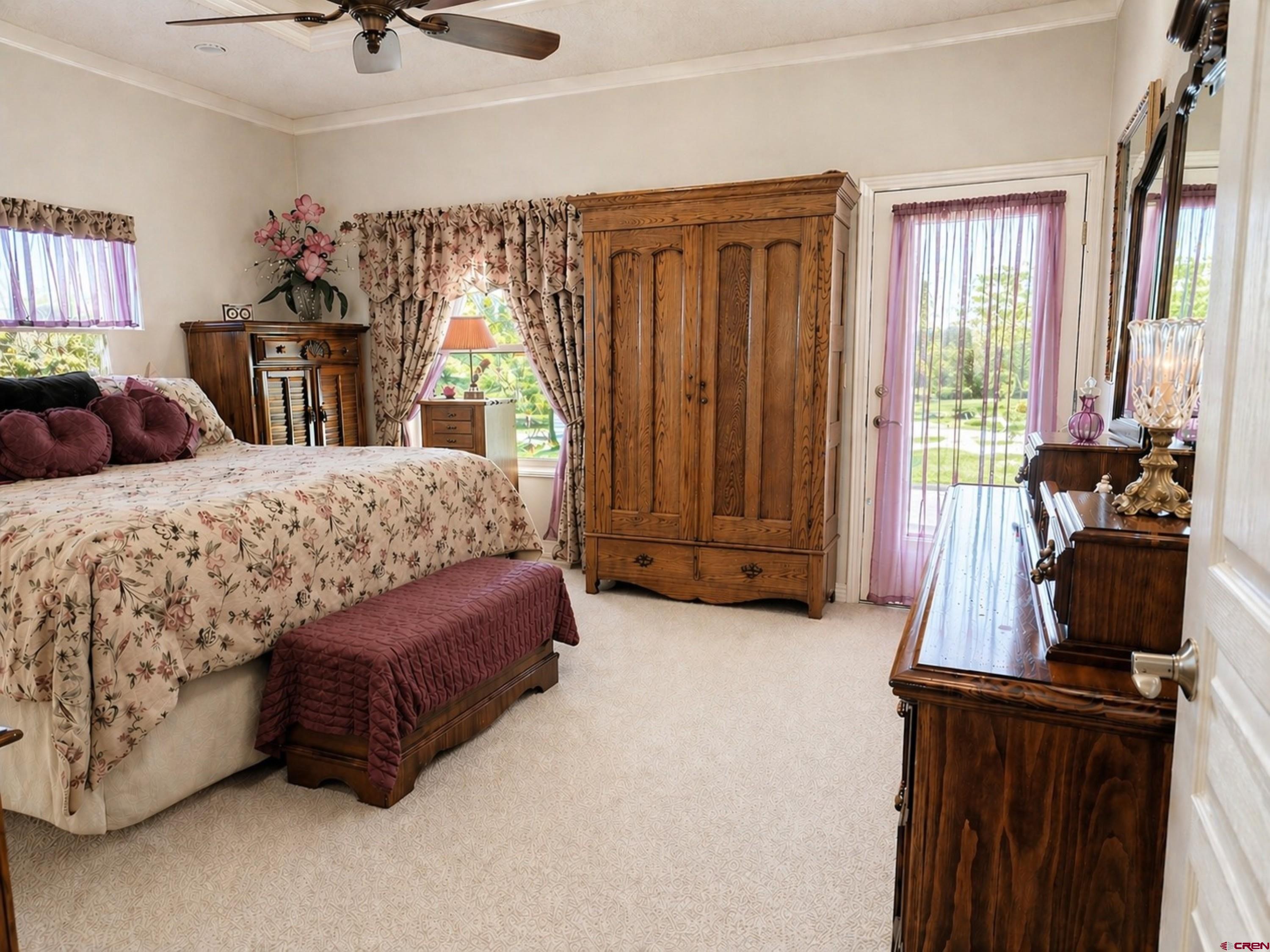 2357 5500th Road Delta, CO 81416 - Photo 14 of 37 a bedroom with a bed dresser and a window