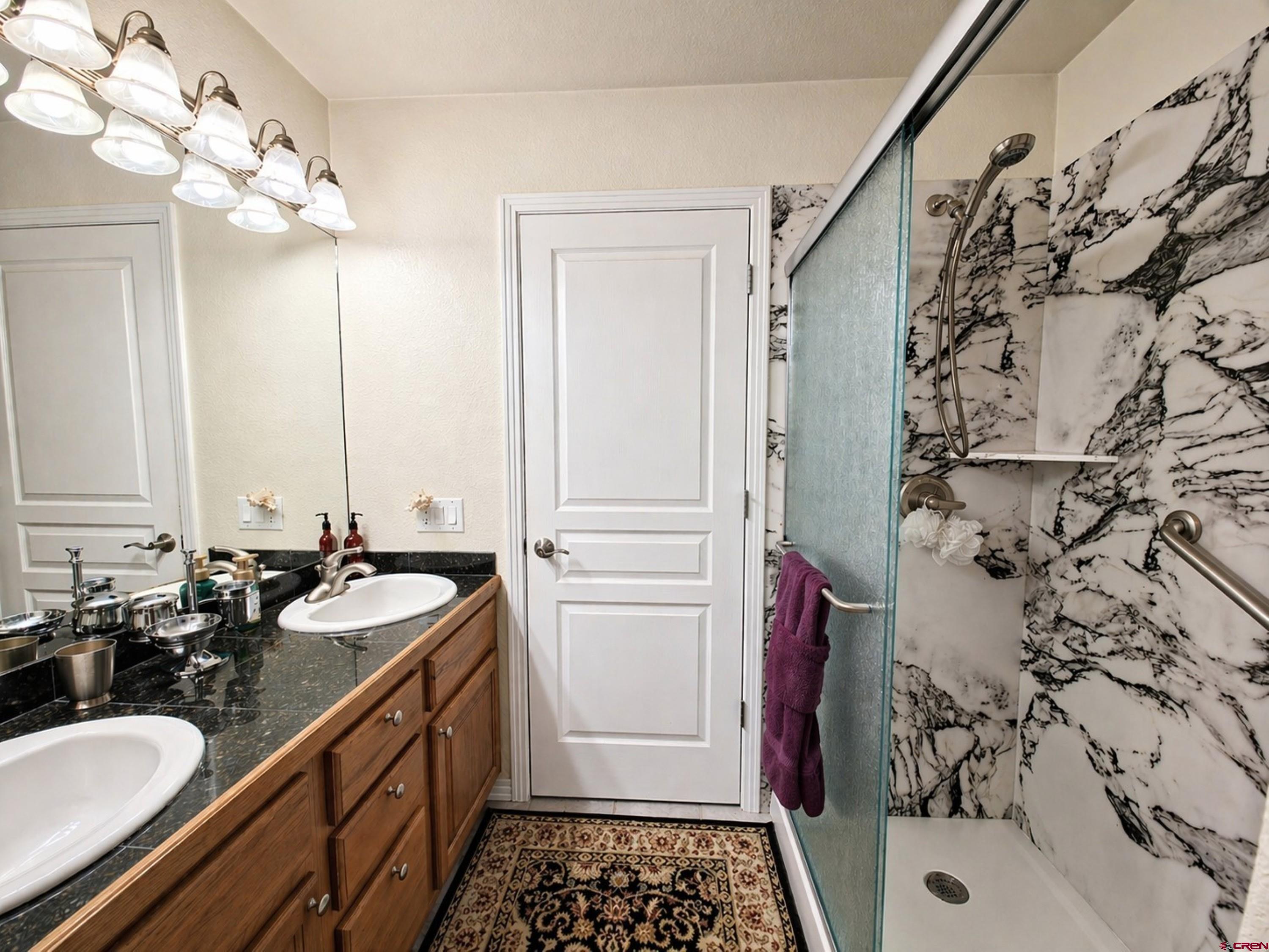 2357 5500th Road Delta, CO 81416 - Photo 22 of 37 a bathroom with a tub sink and mirror