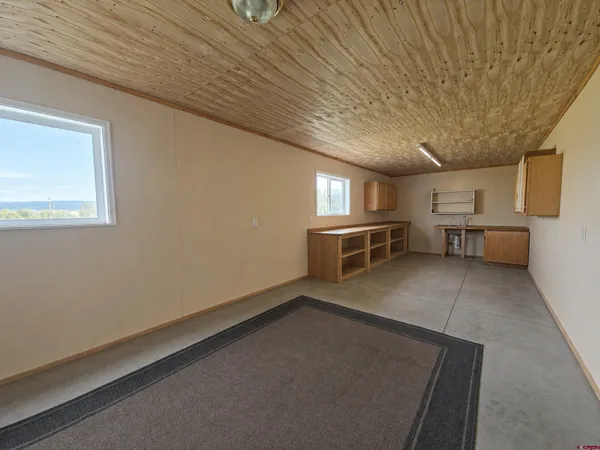 a view of kitchen with furniture and window