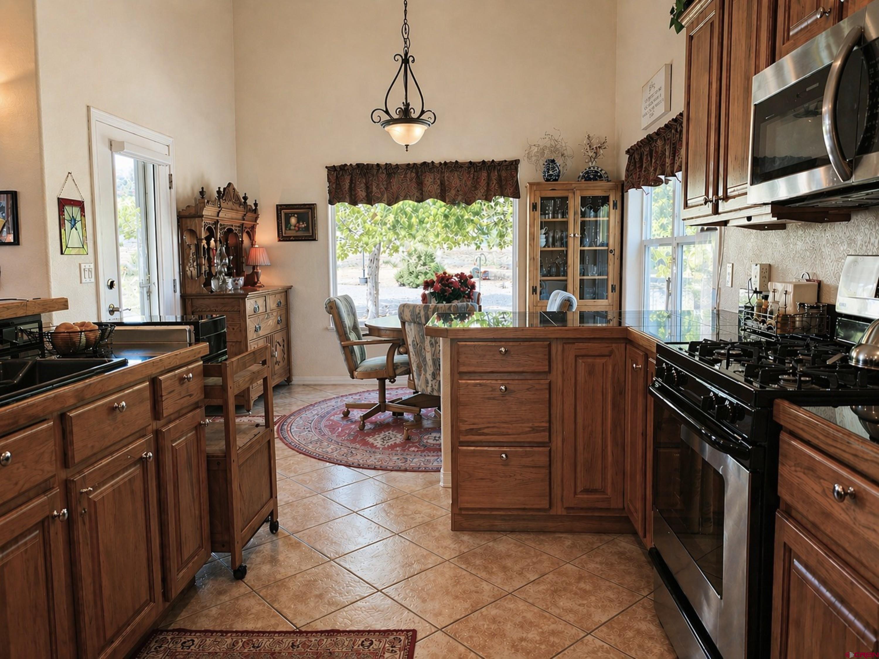 2357 5500th Road Delta, CO 81416 - Photo 7 of 37 a kitchen with a sink stove and microwave