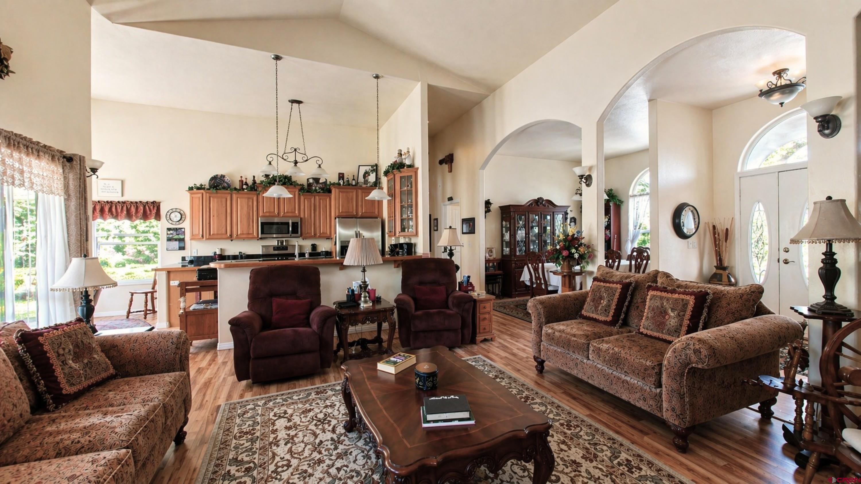 2357 5500th Road Delta, CO 81416 - Photo 9 of 37 a living room with furniture wooden floor and a chandelier