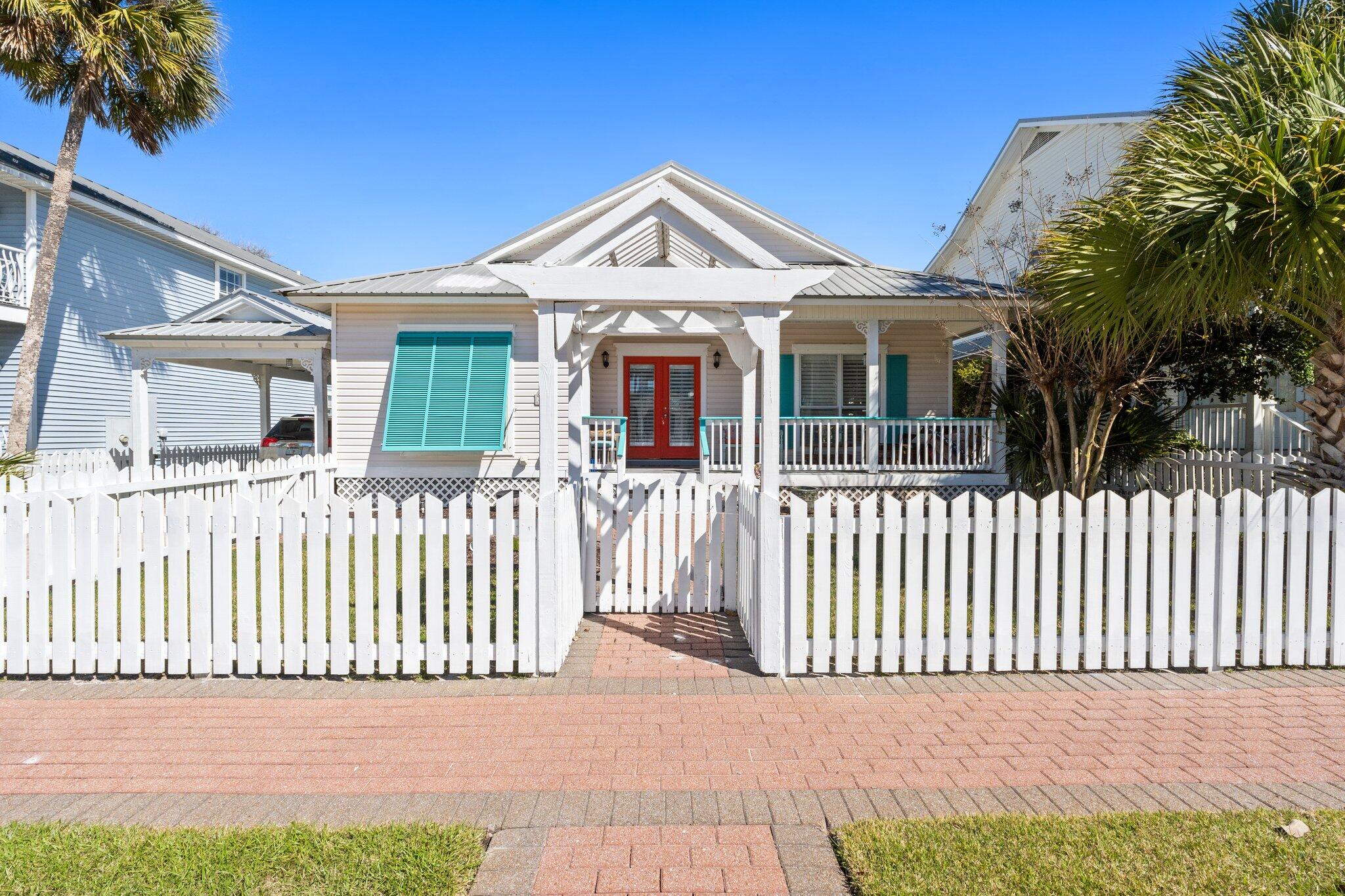 4460 Ocean View Drive Destin, FL 32541 - Photo 1 of 53 a front view of a house with a garden