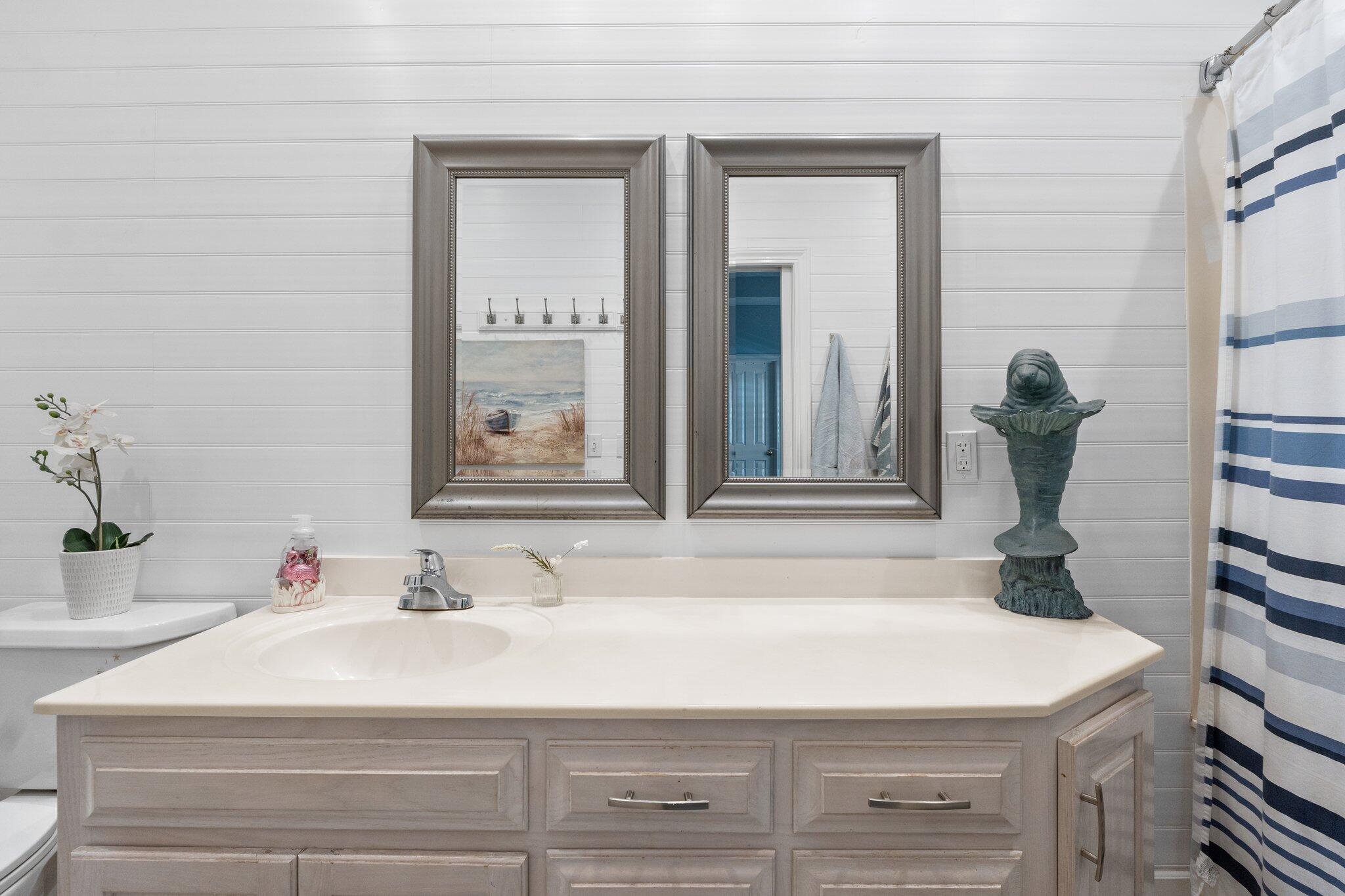 4460 Ocean View Drive Destin, FL 32541 - Photo 29 of 53 a bathroom with a sink and a mirror