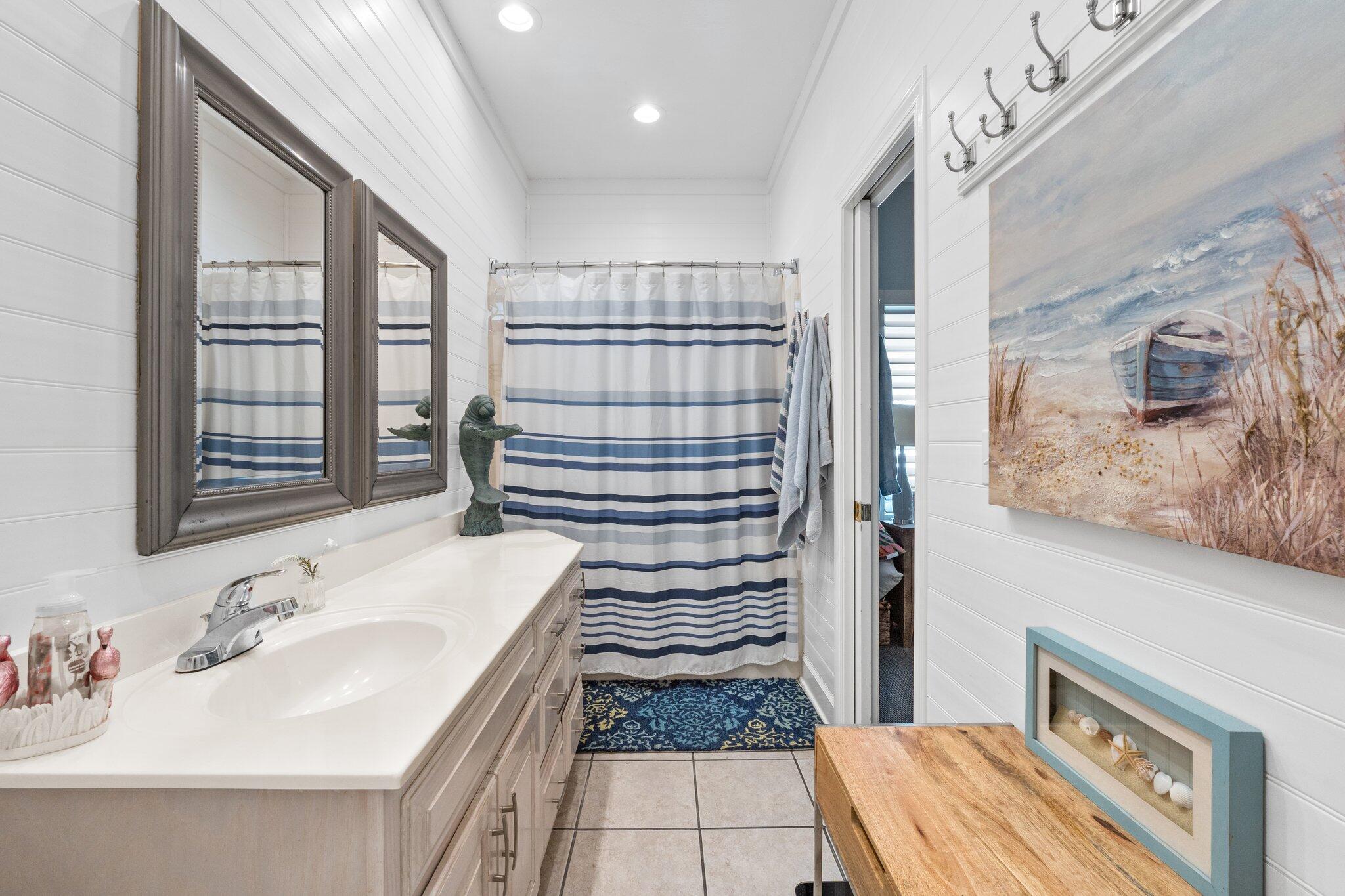 4460 Ocean View Drive Destin, FL 32541 - Photo 30 of 53 a bathroom with a sink a toilet and shower