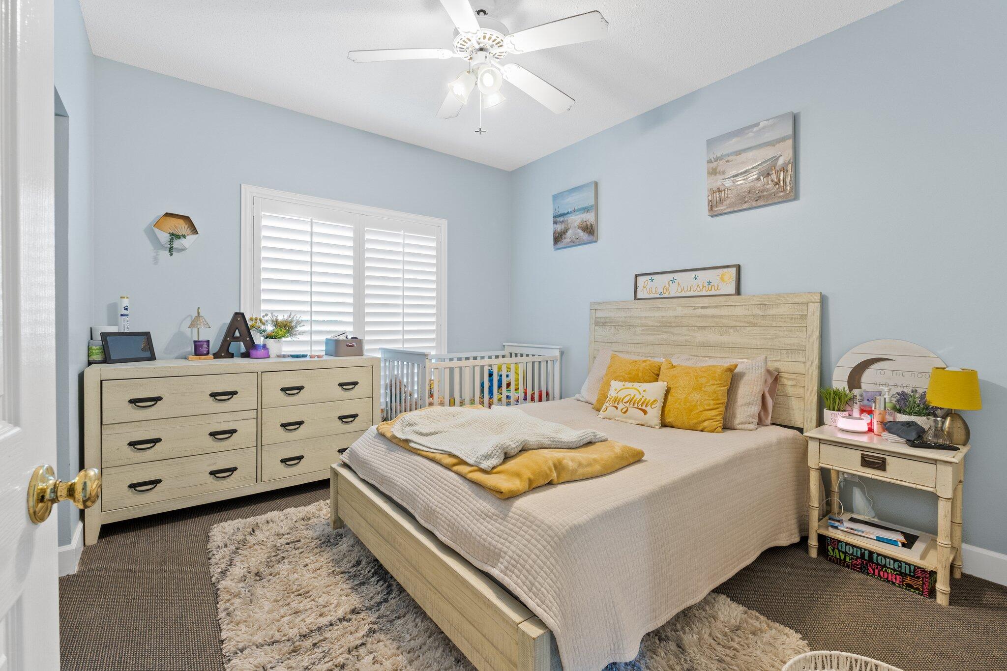 4460 Ocean View Drive Destin, FL 32541 - Photo 32 of 53 a bedroom with a bed and a dresser in it