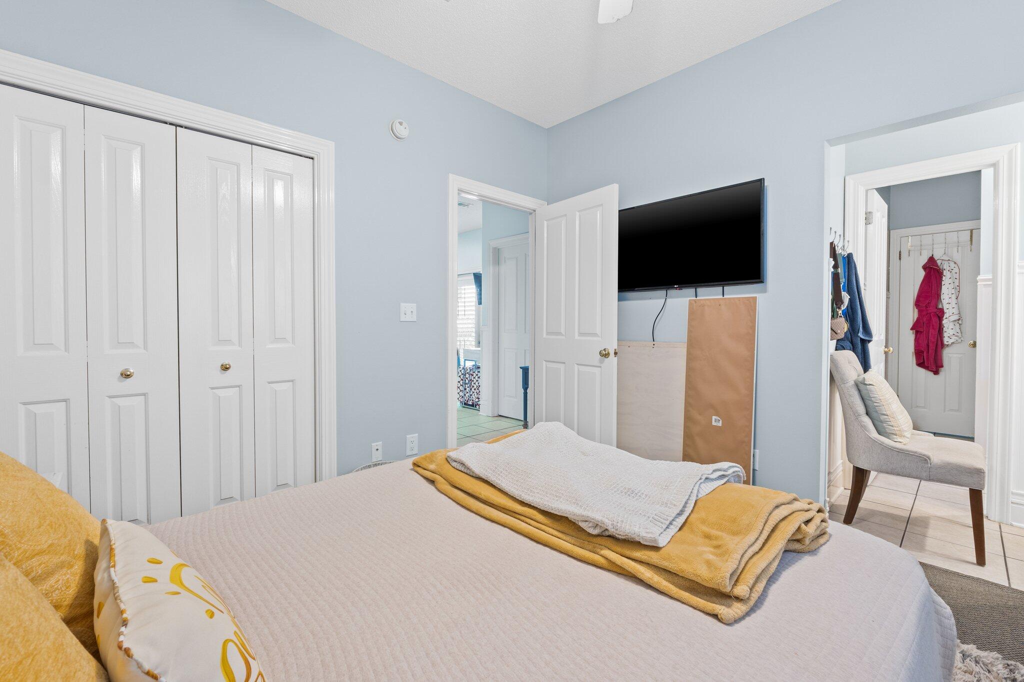 4460 Ocean View Drive Destin, FL 32541 - Photo 34 of 53 a bedroom with a bed and a flat screen tv