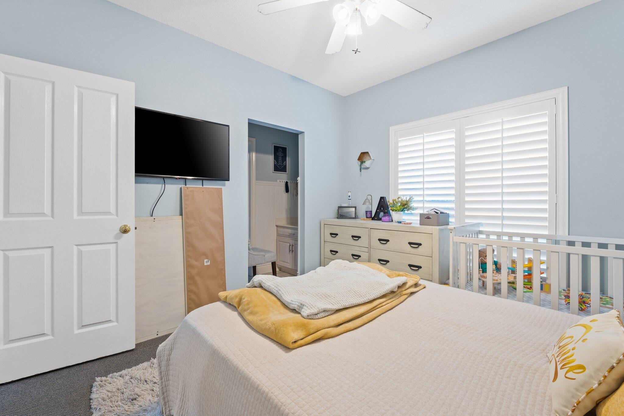 4460 Ocean View Drive Destin, FL 32541 - Photo 35 of 53 a bedroom with a bed and flat screen tv