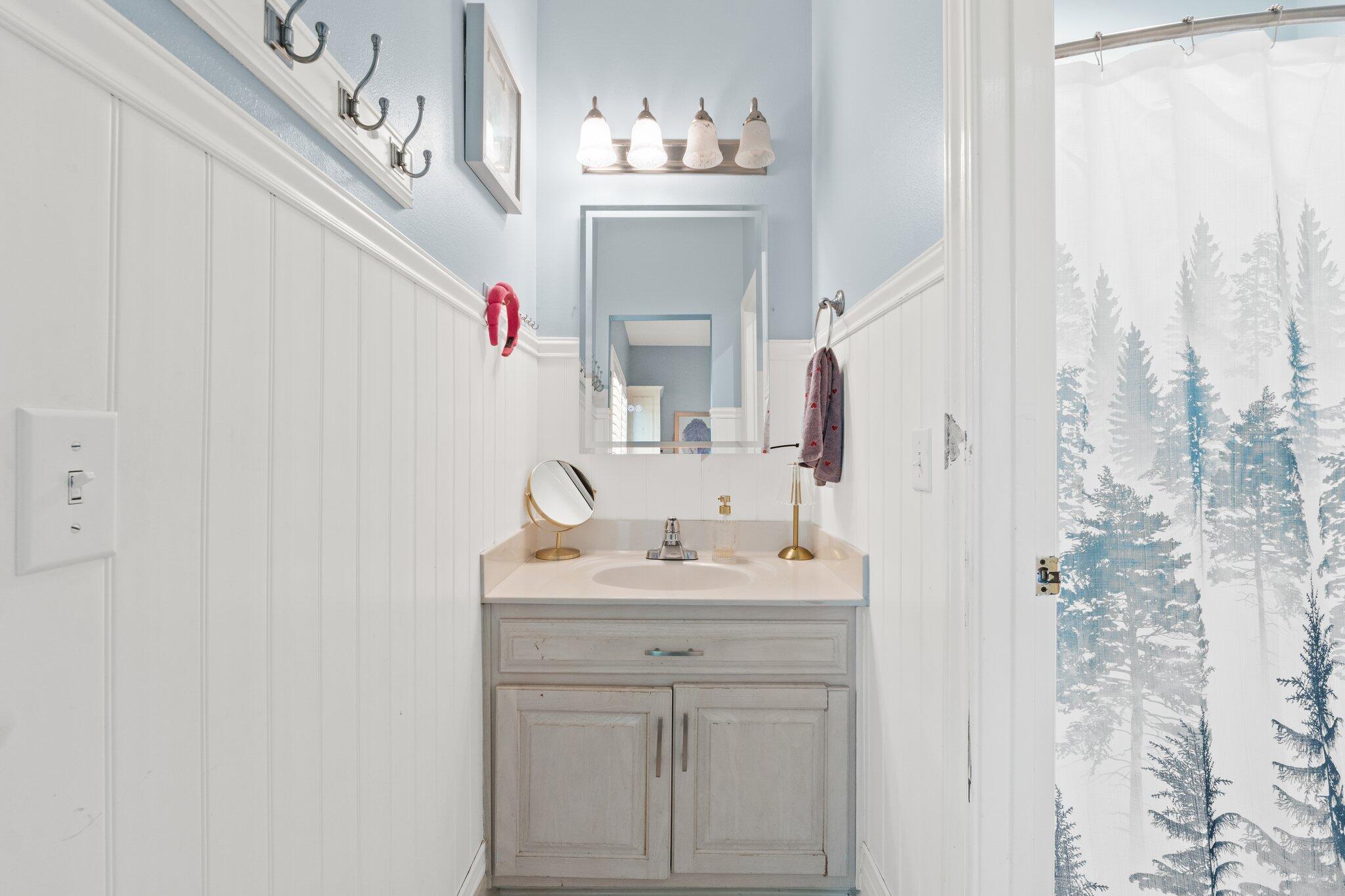4460 Ocean View Drive Destin, FL 32541 - Photo 36 of 53 a bathroom with a sink vanity and a mirror