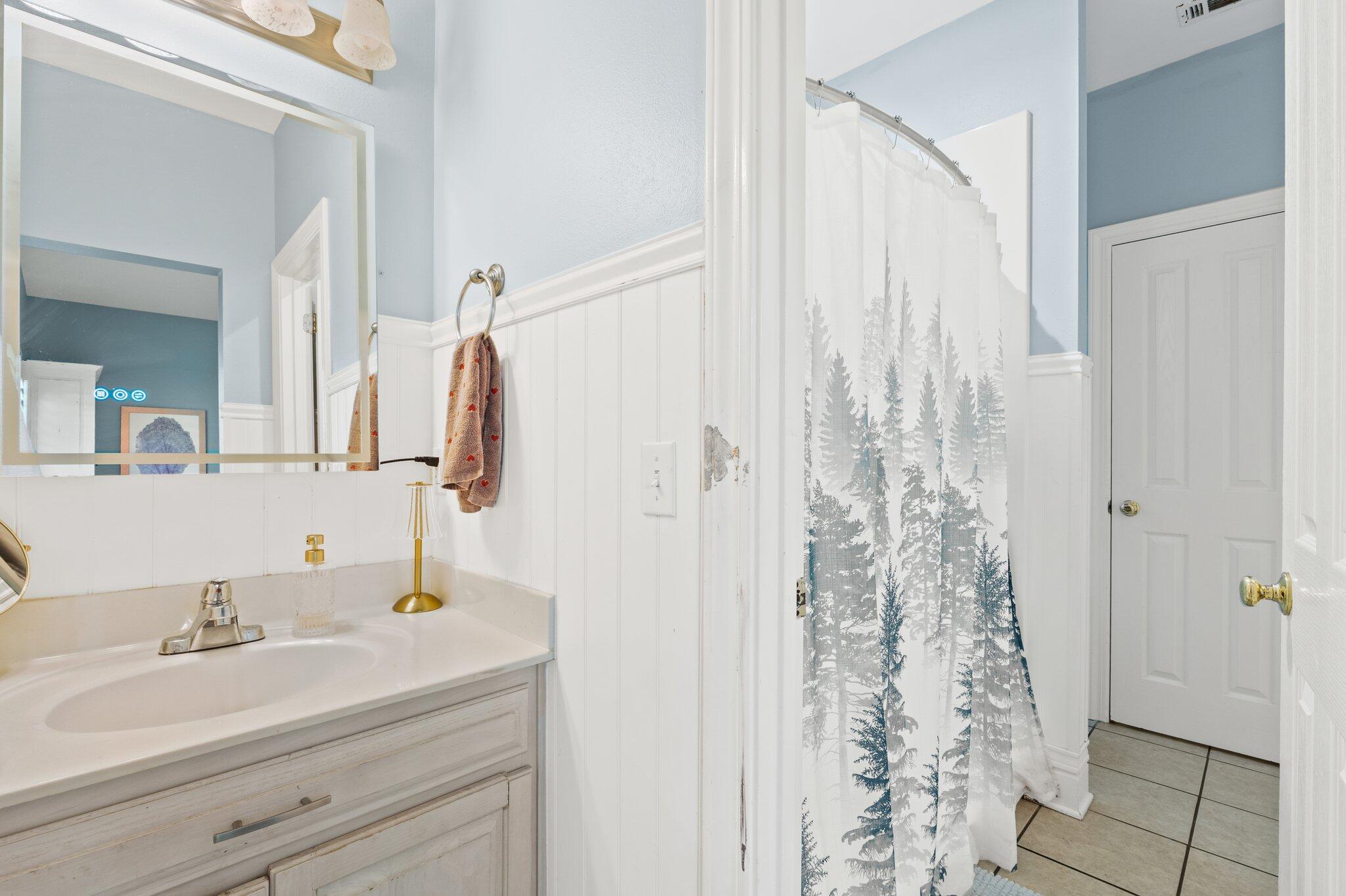 4460 Ocean View Drive Destin, FL 32541 - Photo 37 of 53 a bathroom with a sink and a mirror