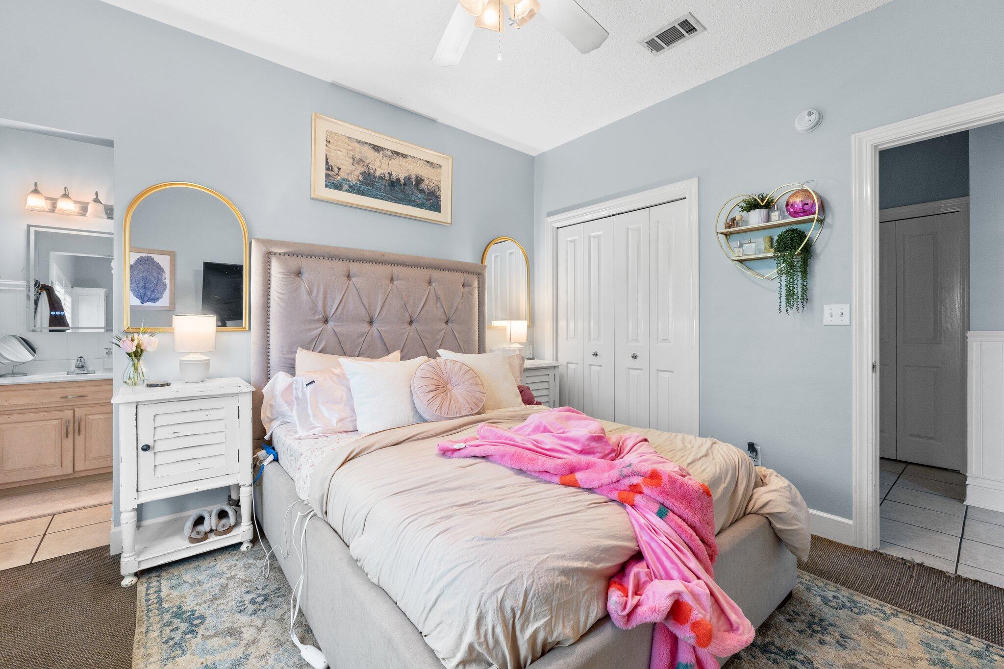 4460 Ocean View Drive Destin, FL 32541 - Photo 38 of 53 a bedroom with a bed and a chandelier