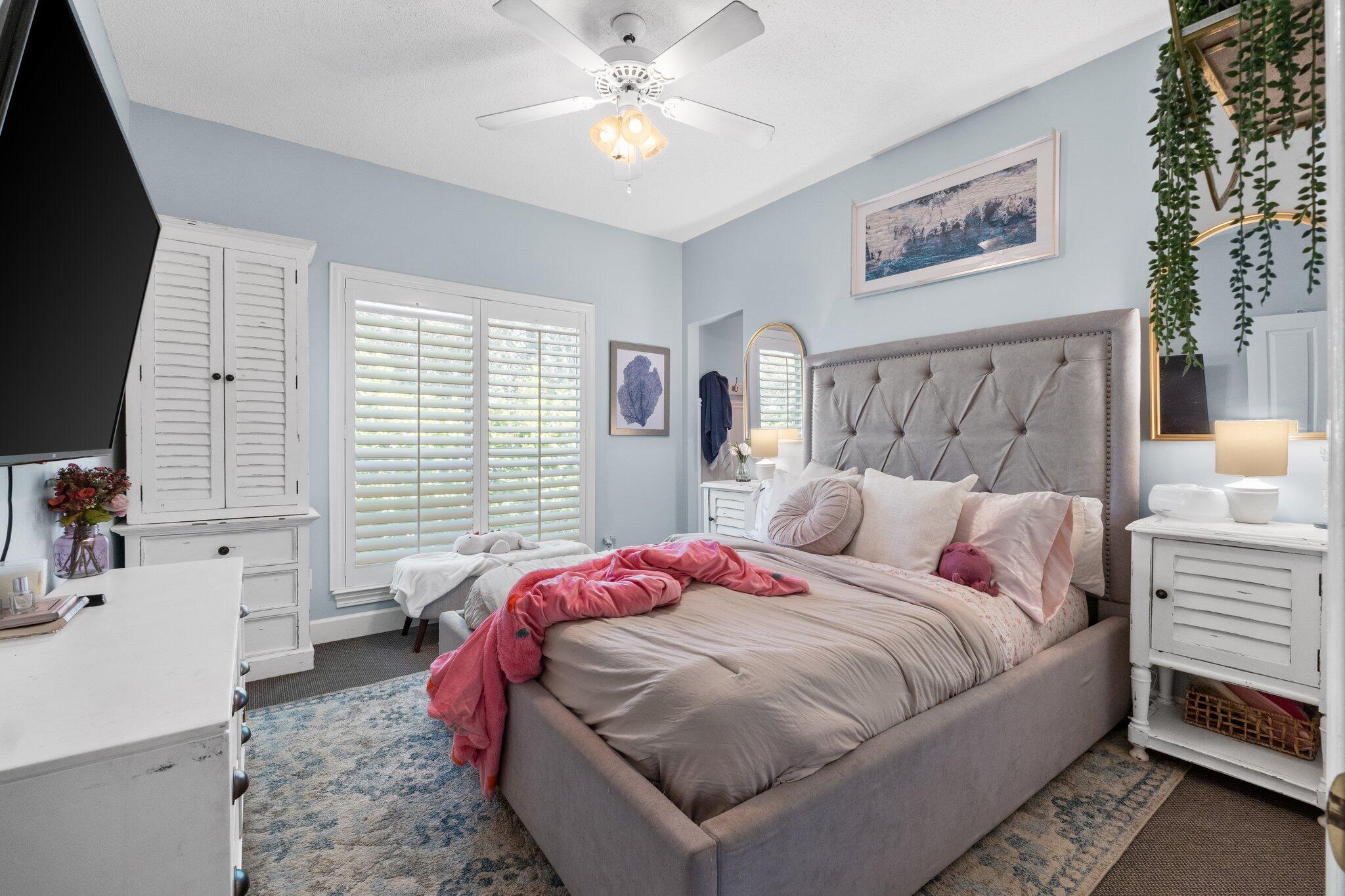 4460 Ocean View Drive Destin, FL 32541 - Photo 39 of 53 a bedroom with a bed and a chandelier