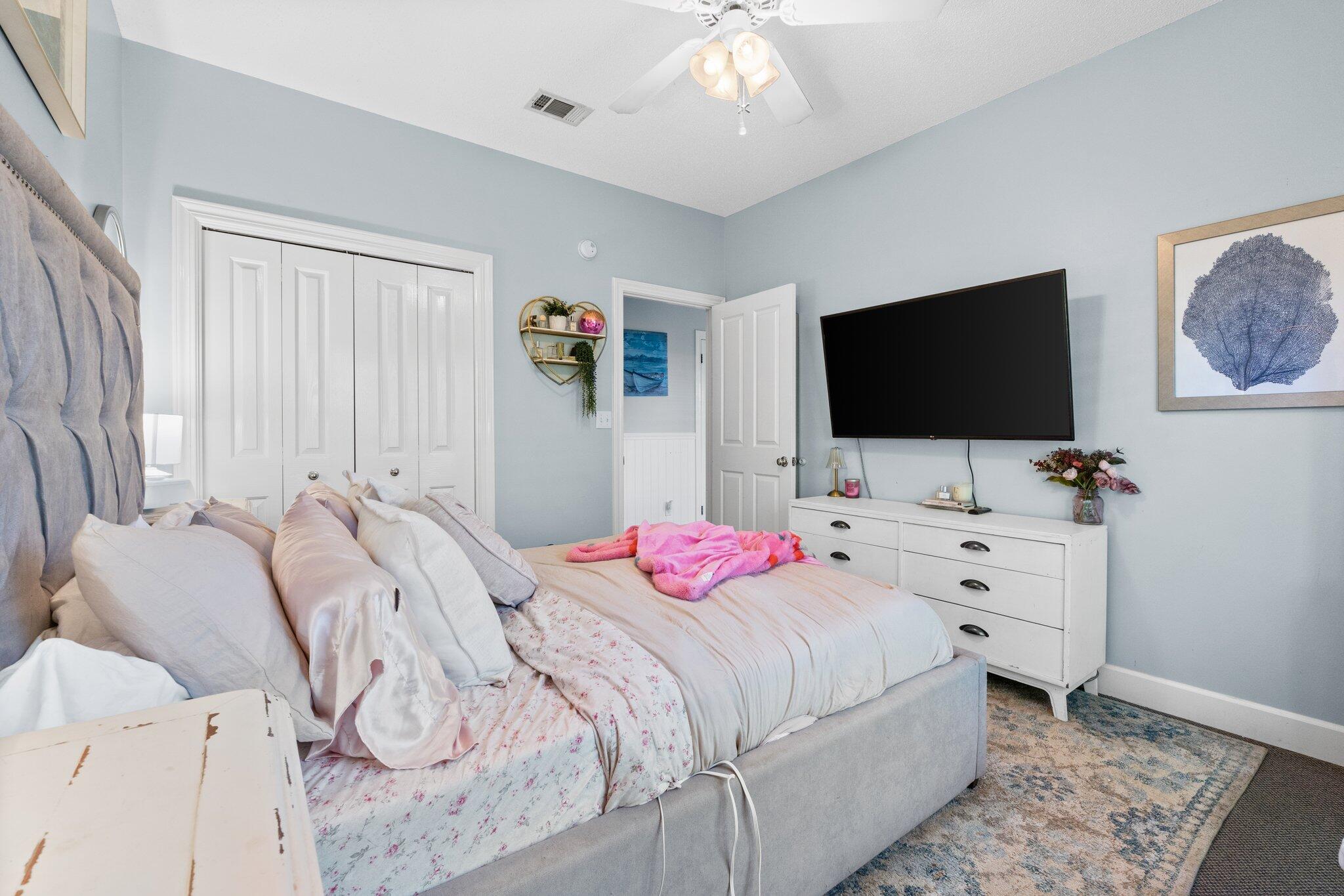 4460 Ocean View Drive Destin, FL 32541 - Photo 40 of 53 a bedroom with a bed and a flat screen tv