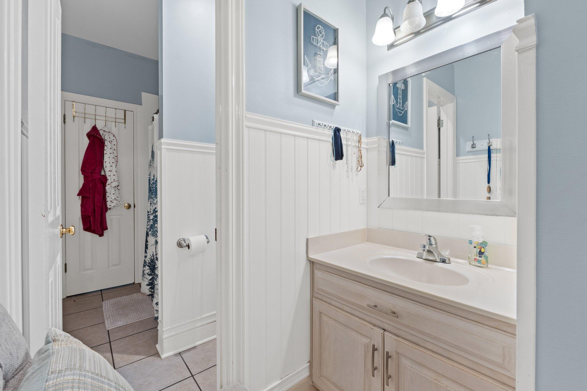4460 Ocean View Drive Destin, FL 32541 - Photo 42 of 53 a bathroom with a sink and a mirror
